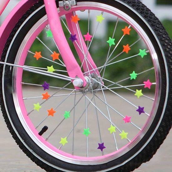 Foto: Spaakkralen spaakdecoratie multicolor ster fietsdecoratie kinderfiets versieren verjaardagscadeau kinderfeestje