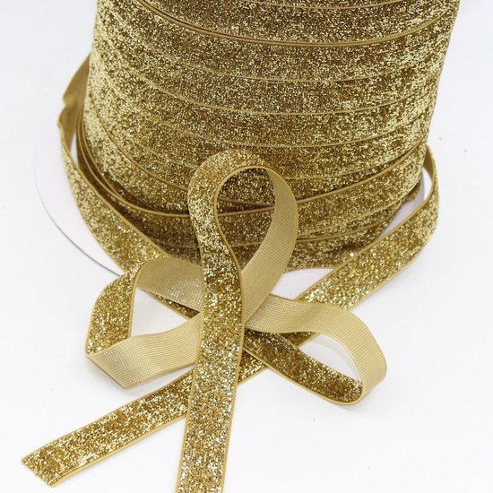 Gouden glitter elastisch lint met een zachte textuur, 15mm breed, op een rol.