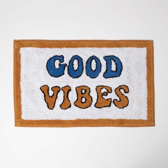 Witte badmat met oranje rand, tekst 'GOOD VIBES' in blauwe en oranje letters.