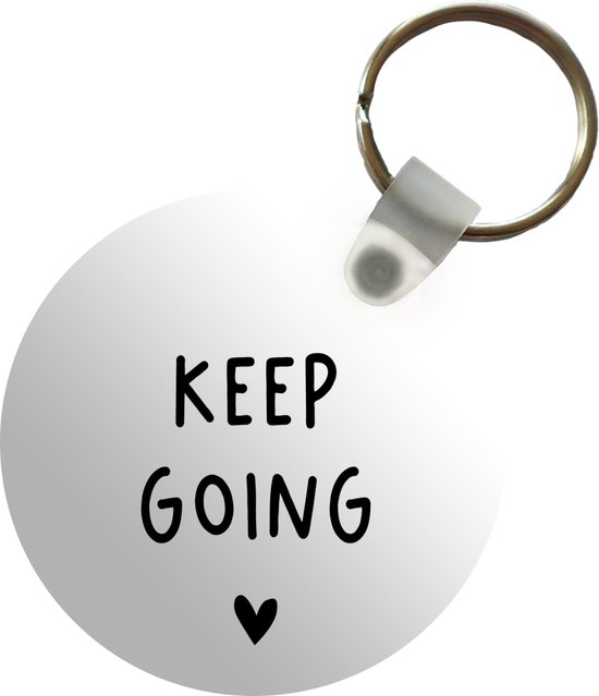 Sleutelhanger - Engelse quote Keep going met een hartje tegen een witte achtergrond - Plastic - Rond - Uitdeelcadeautjes