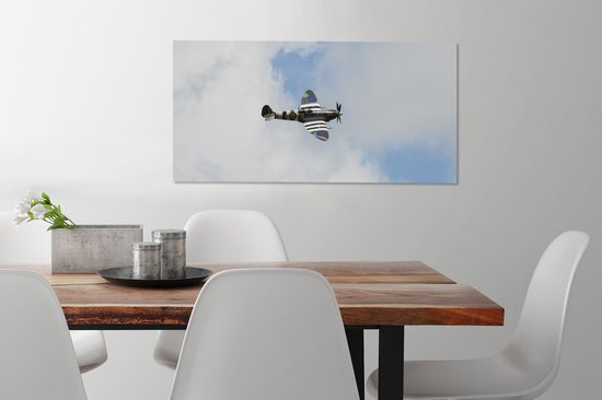 Tableau sur toile Avion Spitfire dans un ciel nuageux - 80x40 cm - Décoration murale