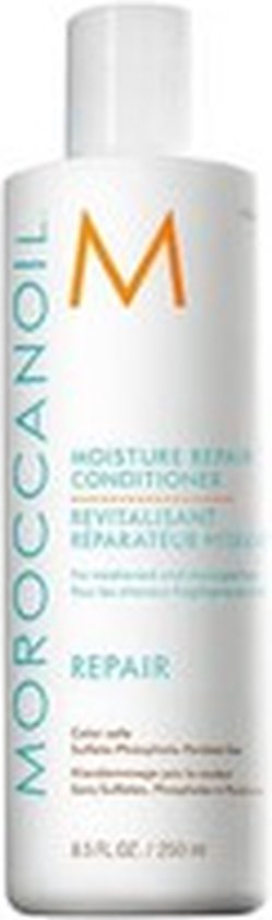Witte fles Moroccanoil "Moisture Repair Conditioner" in het Engels en Frans. "Repair" staat in blauwe letters.
