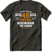 45 Jaar Legend T-Shirt | Goud - Wit | Grappig Verjaardag en Feest Cadeau Shirt | Dames - Heren - Unisex | Tshirt Kleding Kado | - Donker Grijs - S
