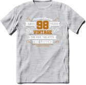 98 Jaar Legend T-Shirt | Goud - Wit | Grappig Verjaardag en Feest Cadeau Shirt | Dames - Heren - Unisex | Tshirt Kleding Kado | - Licht Grijs - Gemaleerd - M