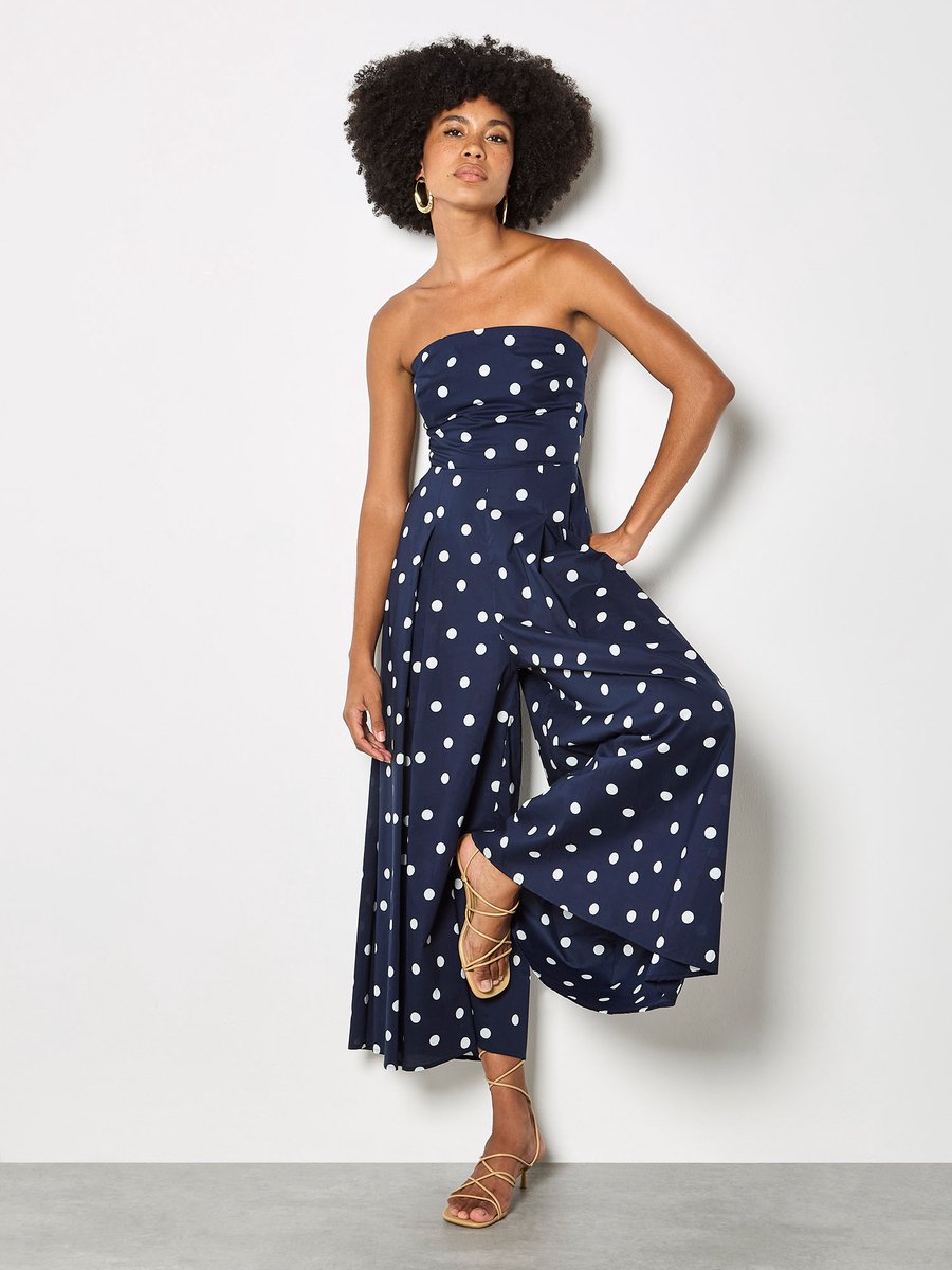 Jumpsuit met stippen en strik op de rug