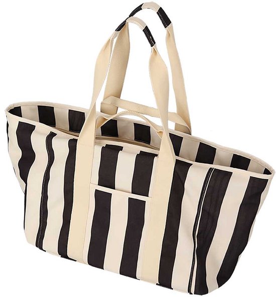 Grote XL strandtas met beige en zwarte strepen, dubbele hengsels en een voorvak met rits.