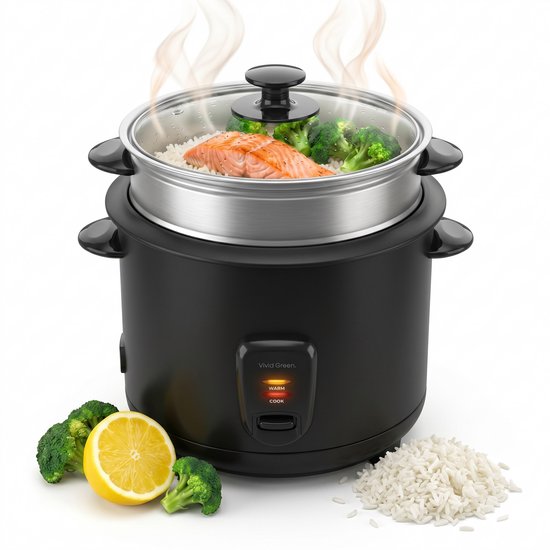 Zwarte rijstkoker met glazen deksel, stoomt zalm en broccoli boven rijst. Citroen en broccoli ernaast.