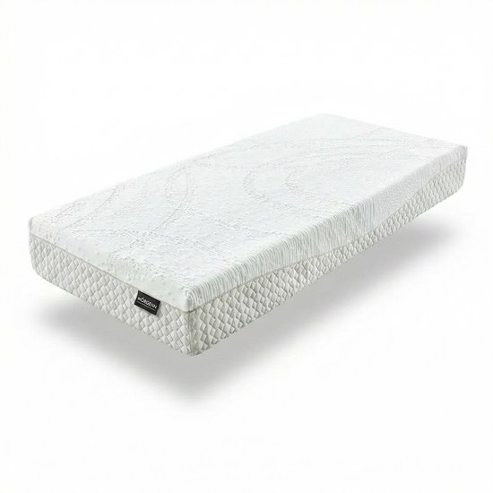 Wit matras met gestructureerde bovenzijde en gewatteerde zijkanten, zwevend. Zwart label met 'MÖRGENN' zichtbaar.