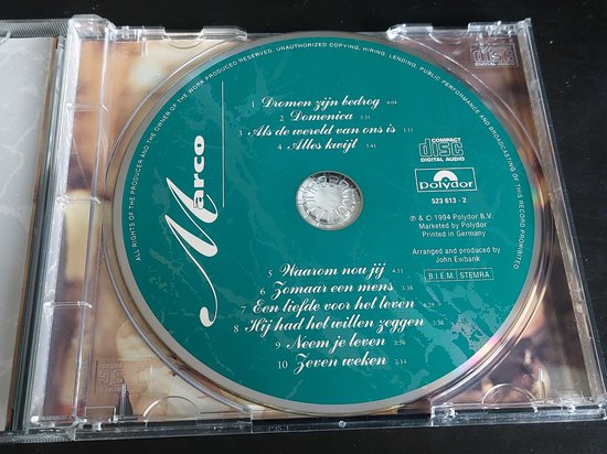 CD-hoes met een turquoise label waarop de titel 'Marco' en de tracklist staan. In het midden het logo van Polydor.