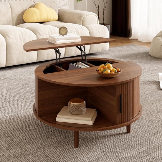 Ronde walnoot salontafel met opklapbaar blad, open vak met fruit en boeken, gesloten vak met boek en vaas, en een klok op het blad.
