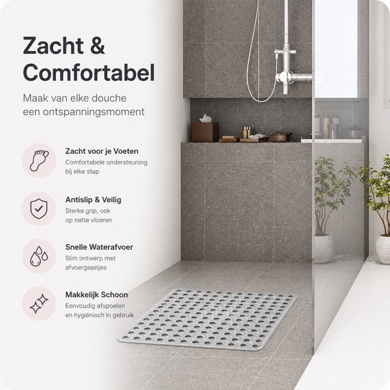 Grijze antislip douchemat met ronde noppen, ligt in een moderne grijze badkamer.