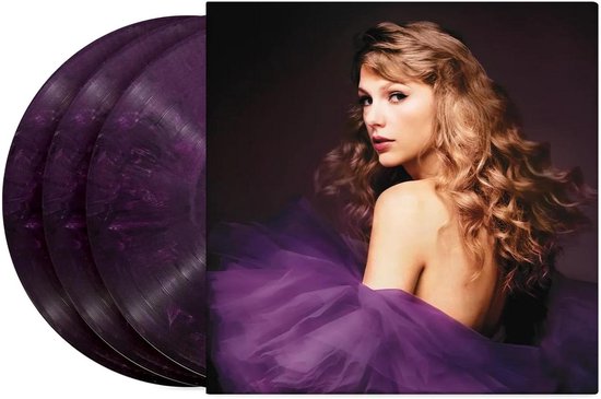 Drie paarse, gemarmerde vinylplaten naast een albumhoes met Taylor Swift in een paarse jurk.