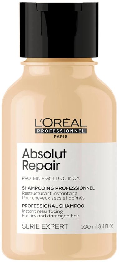 Shampoing L'Oréal Absolut Repair dans une bouteille couleur crème avec un bouchon noir. "Absolut Repair" et "100 ml 3.4 FL.OZ" sont visibles.