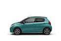 Turquoise Citroën C1, zijaanzicht, met zwarte accenten en lichtmetalen velgen.