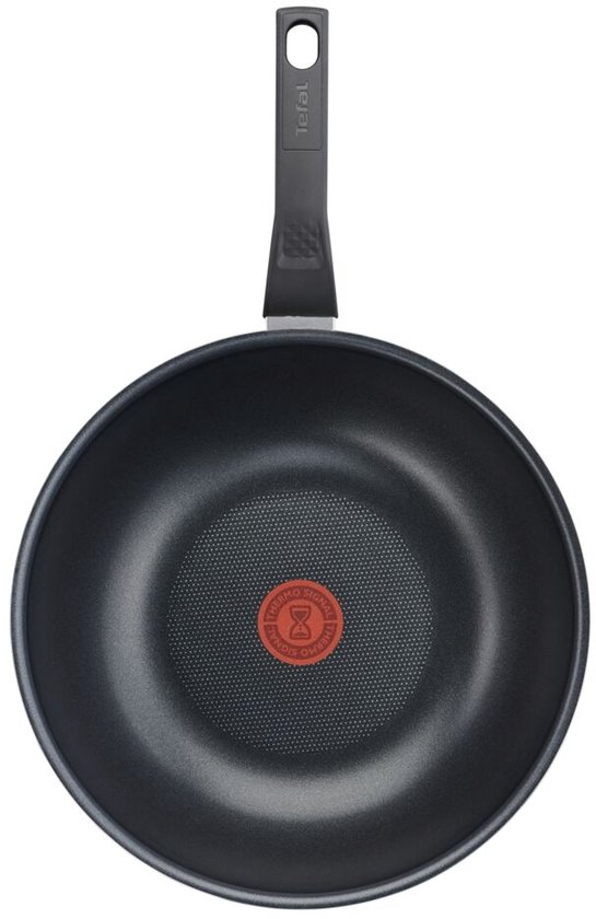 Zwarte Tefal wokpan met rode Thermo-Spot indicator in het midden en een zwart handvat.