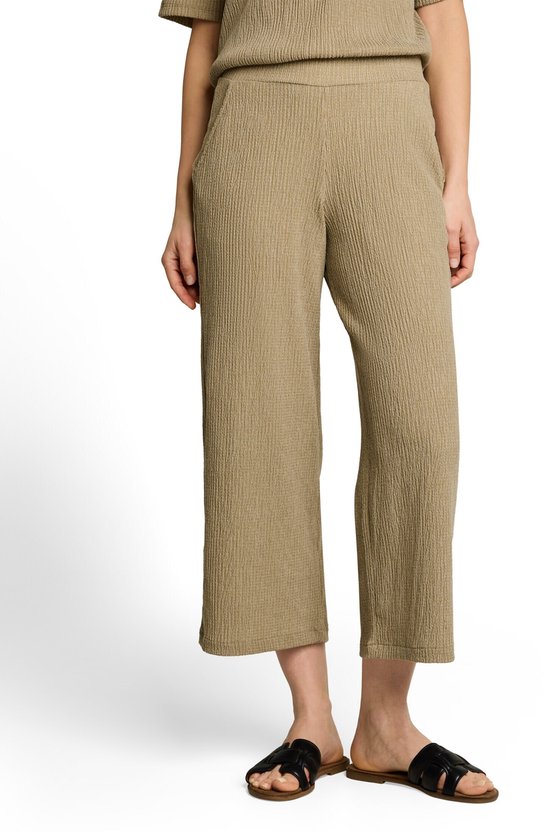 Dames culottebroek in olijfwit met structuur, close-up van de zak.