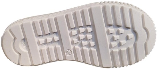 Onderkant van een beige sneaker zool met profiel.