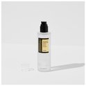 Transparante fles met pompdispenser, dop ernaast, en label 'Advanced Snail 96 Mucin Power Essence'.