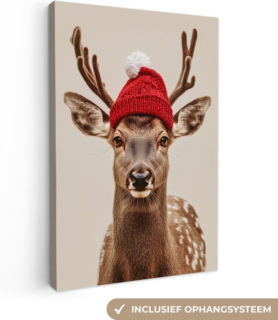 Canvas schilderij 80x120 cm - Wanddecoratie Hert - Kerst - Muts - Dieren - Winter - Grappig - Muurdecoratie woonkamer - Slaapkamer decoratie - Kamer accessoires - Schilderijen - Kerstdecoratie voor binnen - Kerstversiering - Kerstmis versiering