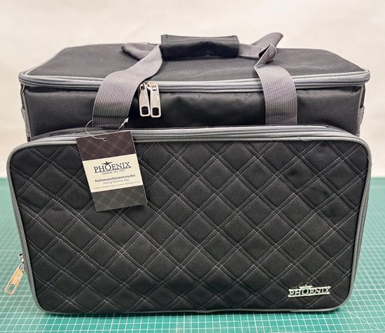 Zwarte Phoenix naaimachinetas met ruitpatroon en grijze accenten.