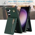 Étui de téléphone vert foncé avec fermeture éclair, ouvert en support pour un téléphone.