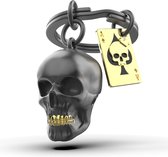 Porte-clés Metalmorphose crâne noir avec carte à jouer
