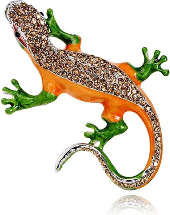 Broche lézard orange avec pattes et queue vertes, ornée de pierres scintillantes brunes.