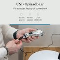 Zilverkleurige tondeuse wordt opgeladen via USB. Tekst: 'USB Oplaadbaar', '180 min. gebruik', '180 min. opladen'.