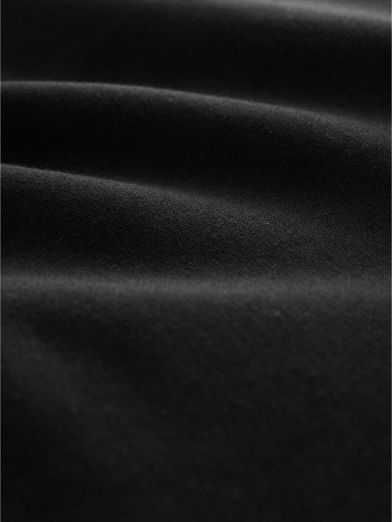 Gedetailleerde close-up van de textuur van zwarte stof.