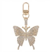 Goudkleurige sleutelhanger vlinder vorm met strass steentjes en metalen sluiting, tas hanger en sleutelhanger voor dames, decoratief accessoire met fonkelend detail en sierlijk ontwerp
