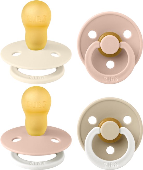 Vier BIBS spenen in crème, roze en beige. Twee met ronde speen, twee met symmetrische speen.