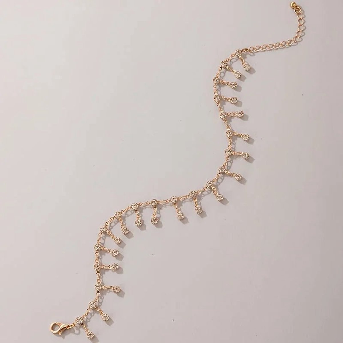Aramat Jewels | Enkelbandjes | Goudkleurig Enkelbandje met Zirkonia Steentjes | Transparant | |3mm | Metaal | Volwassenen | Verkleurd niet