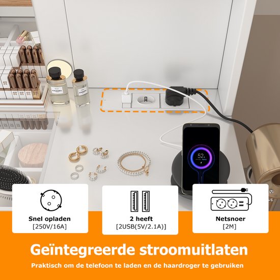 Geïntegreerde stopcontacten en USB-poorten op de kaptafel, met telefoon en oplader.