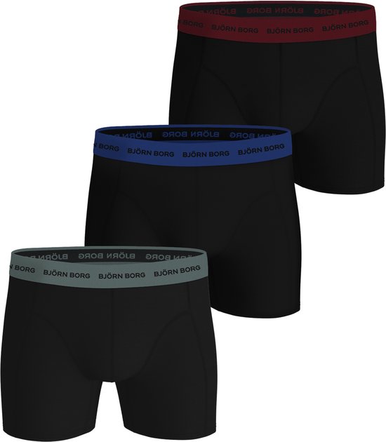 Drie Björn Borg boxershorts in het zwart met gekleurde taillebanden: rood, blauw en grijs, elk met logo.