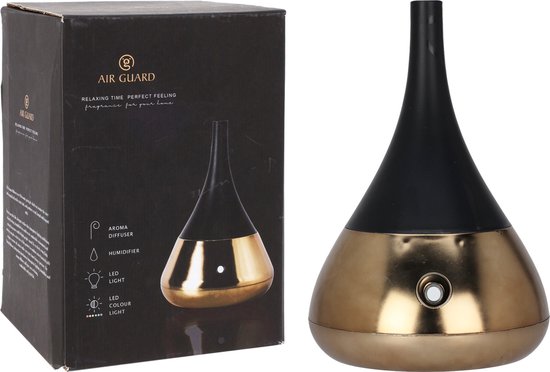 Gouden en zwarte aroma diffuser met druppelvorm. De doos toont "AIR GUARD RELAXING TIME PERFECT FEELING fragrance for your home".