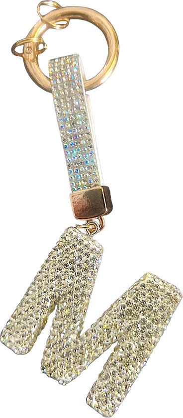 Porte-clés doré avec la lettre M, orné de strass.