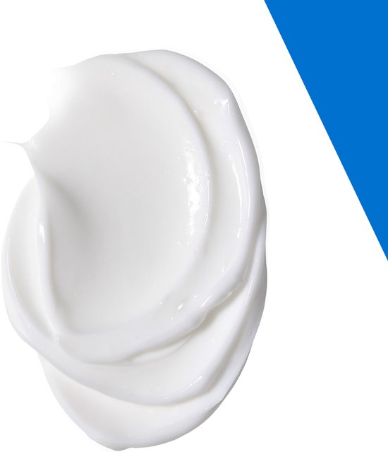 Een witte, romige crème op een witte achtergrond met een blauwe driehoekige vlek.