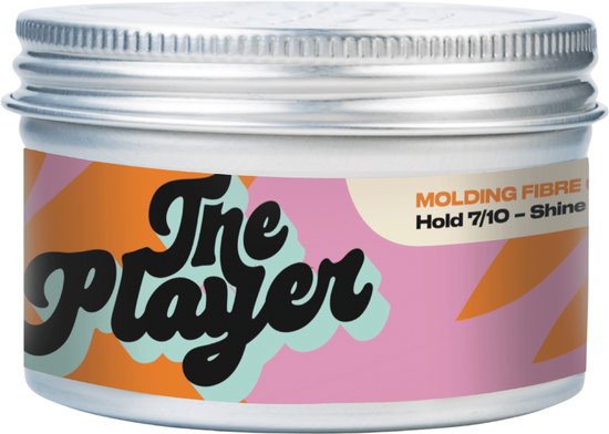 Een potje 'The Player Molding Fibre' met een kleurrijk label van oranje, roze en lichtblauwe vormen. 'NEW DESIGN' staat in een zwart rondje.