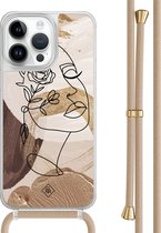 Casimoda® hoesje met beige koord - Geschikt voor iPhone 14 Pro Max - Abstract Gezicht Bruin - Afneembaar koord - TPU/polycarbonaat - Bruin/beige