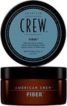 American Crew Fiber pot met bruine basis en blauw deksel.