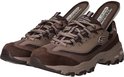 Bruine Skechers D'Lites sneakers met witte en taupe accenten en veters. Binnenzool met 'Air-Cooled Memory Foam' tekst.