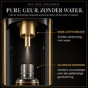 Close-up van de Nira Breeze diffuser die aromaolie vernevelt met koude-lucht technologie, zonder water.