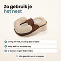 Babynestje in crème en bruin met gebruiksinstructies: stevige ondergrond, baby op de rug, niet geschikt om in te slapen.