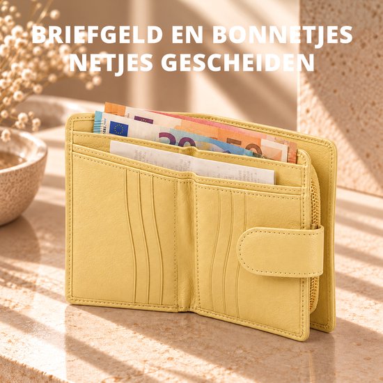 Botergele leren portemonnee met briefgeld en bonnetjes netjes gescheiden in de open vakken.
