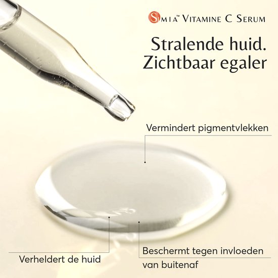Pipet met een druppel helder serum op een glazen oppervlak. "Stralende huid. Zichtbaar egaler".