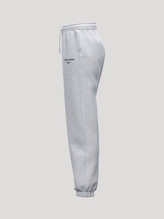 Lichtgrijze joggingbroek met tekst 'BJÖRN BORG' op de linkerheup, trekkoord en elastische tailleband.