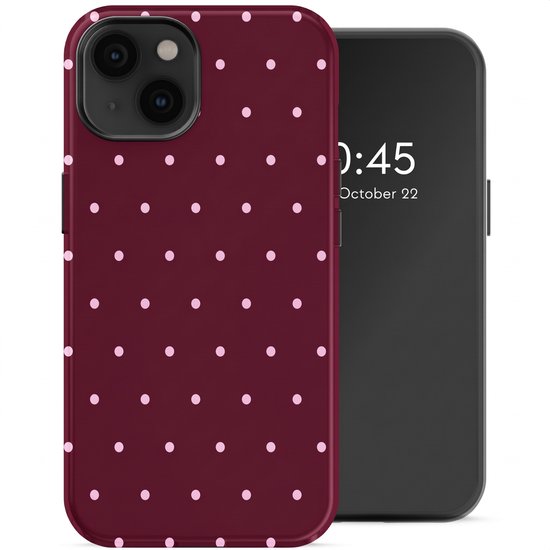 Coque de téléphone bordeaux avec pois rose pâle, à côté d'un smartphone.