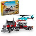 LEGO Creator 3in1 vrachtwagen met helikopter. De vrachtwagen is zwart met rode details en de helikopter is blauw met witte en rode strepen.