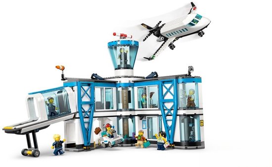 LEGO City luchthaven met vliegtuig en passagiers. Wit en blauw gebouw met vliegtuig in de lucht.
