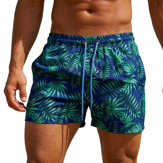 Torse masculin dans un short de bain bleu à imprimé feuilles vertes, taille élastique avec cordon